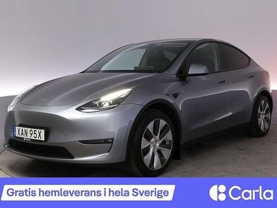 Begagnad Tesla Model Y Long Range AWD 378 kW (514 HK) 2023 Grå SUV