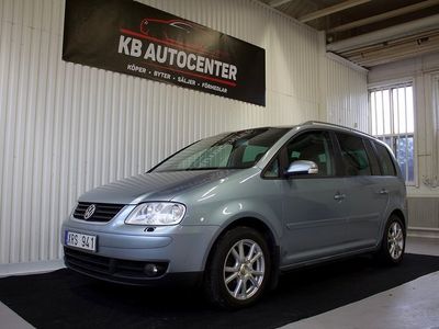 Ljusblå Begagnad 2006 VW Touran Minibuss | 34 900 kr