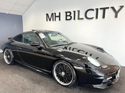 Begagnad Porsche 911 Carrera 4 301 HK (221 kW) 1999 Svart