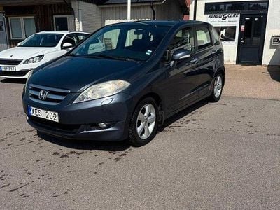Begagnad Honda FR-V 150 HK (110 kW) 2006 Mörkgrå (grå) Minibuss