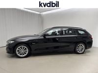 Begagnad BMW 330e 2023 Svart Kombi
