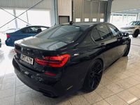 begagnad BMW 750 d xDrive Aut M-sport 500hk Nya 22tum Svart optik