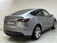 Begagnad Tesla Model Y Long Range RWD 250 kW (340 HK) 2024 Grå SUV
