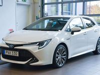 Begagnad Toyota Corolla Hybrid Style 122 HK (89 kW) 2019 Vit Halvkombi