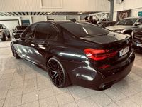 begagnad BMW 750 d xDrive Aut M-sport 500hk Nya 22tum Svart optik