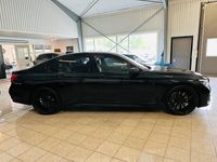 begagnad BMW 750 d xDrive Aut M-sport 500hk Nya 22tum Svart optik