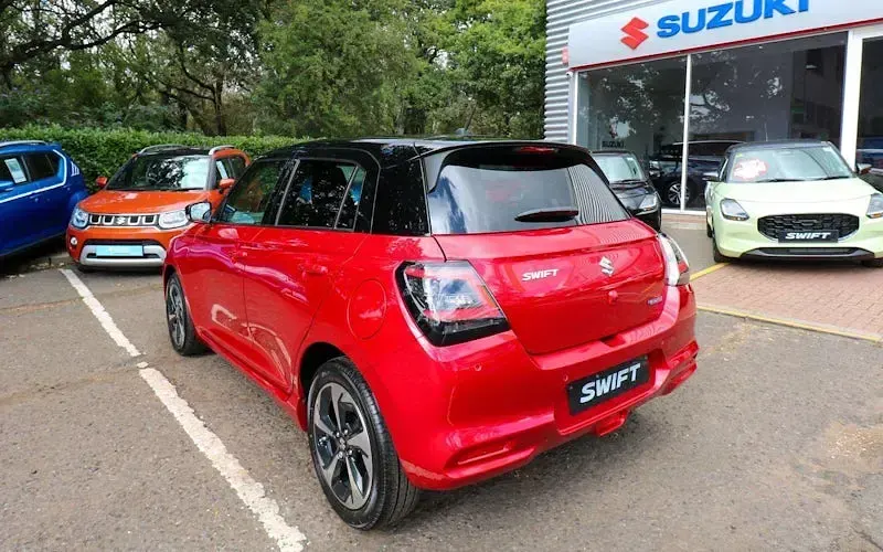 Used Suzuki Swift 82 HP (60 kW) 2026 Burning red pearl / super black pearl Hatchback