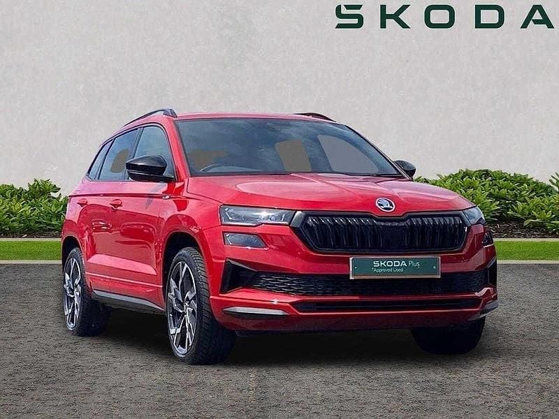 Velvet red metallic Used 2024 Skoda Karoq SportLine SUV | £27,270 (Good price) - Image 1/4