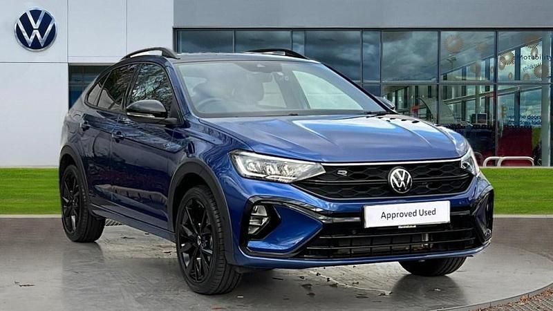 Reef blue metallic black Used 2025 VW Taigo R-line SUV | £22,180 (Fair price) - Image 1/4