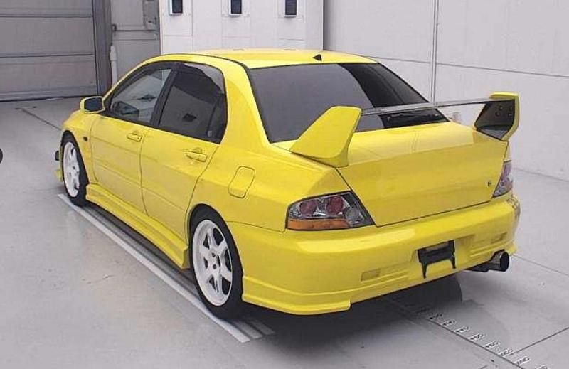 Used Mitsubishi Lancer 276 HP (202 kW) 2003 Yellow Sedan