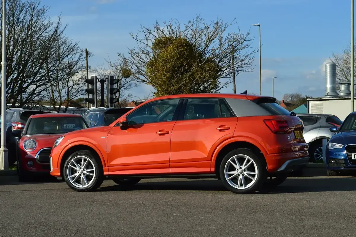 Used Audi Q2 S-Line 116 HP (85 kW) 2018 Coral orange SUV