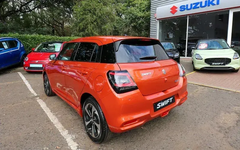 Used Suzuki Swift 82 HP (60 kW) 2026 Flame orange pearl metallic Hatchback