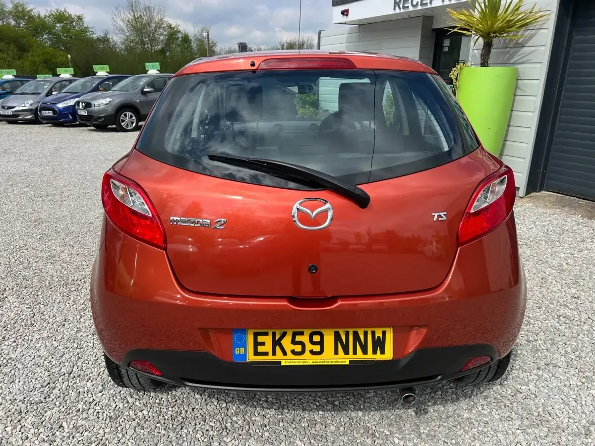 Usado Mazda 2 75 HP (55 kW) 2009 Laranja Citadino
