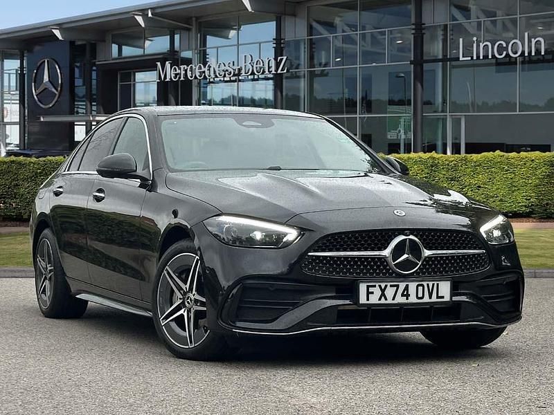 Obsidian black metallic Used 2024 Mercedes C300e AMG Line Premium Plus Sedan | £41,999 - Image 1/4