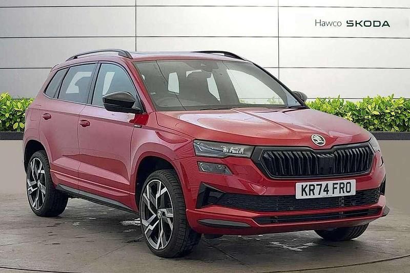 Velvet red metallic Used 2024 Skoda Karoq SportLine SUV | £29,495 (Fair price) - Image 1/4