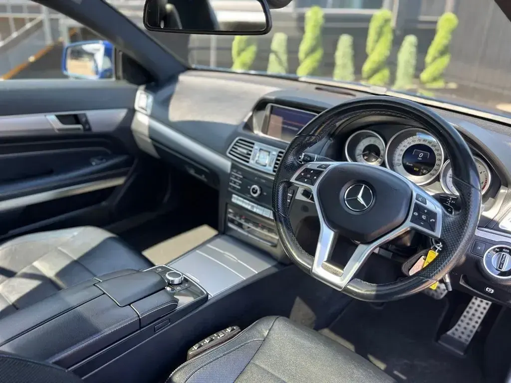 Used Mercedes E220 AMG line 177 HP (130 kW) 2016 Blue Coupe