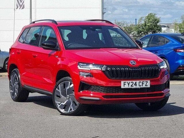 Velvet red Used 2024 Skoda Karoq SportLine SUV | £27,495 (Fair price) - Image 1/4