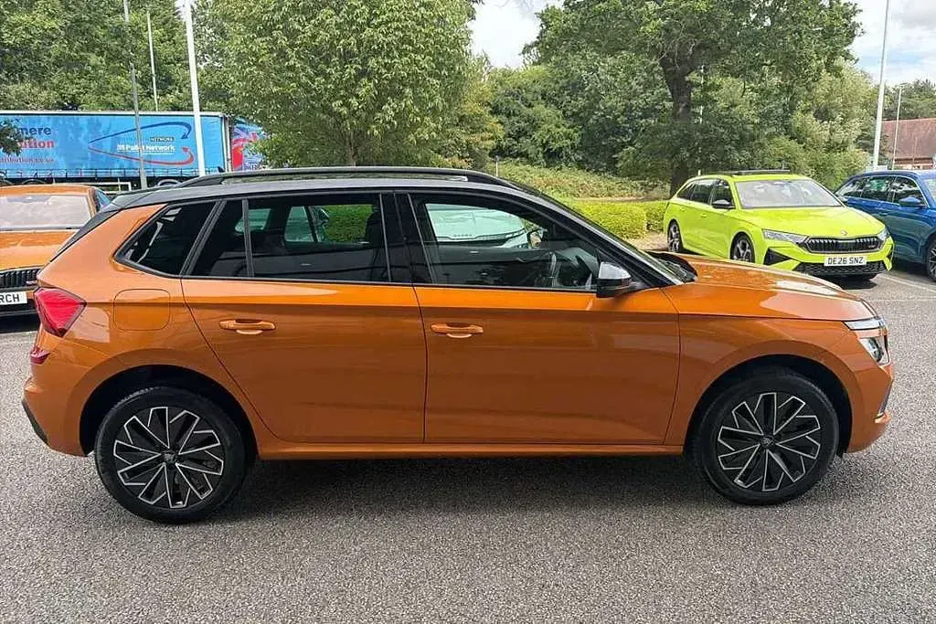 Used Skoda Kamiq Design Edition 113 HP (83 kW) 2025 Phoenix orange metallic black magic pearl effect SUV