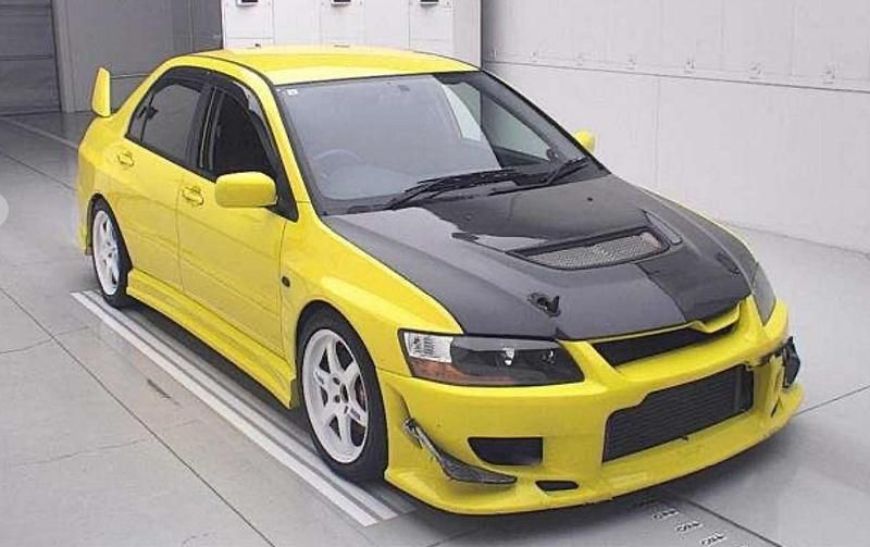 Used Mitsubishi Lancer 276 HP (202 kW) 2003 Yellow Sedan