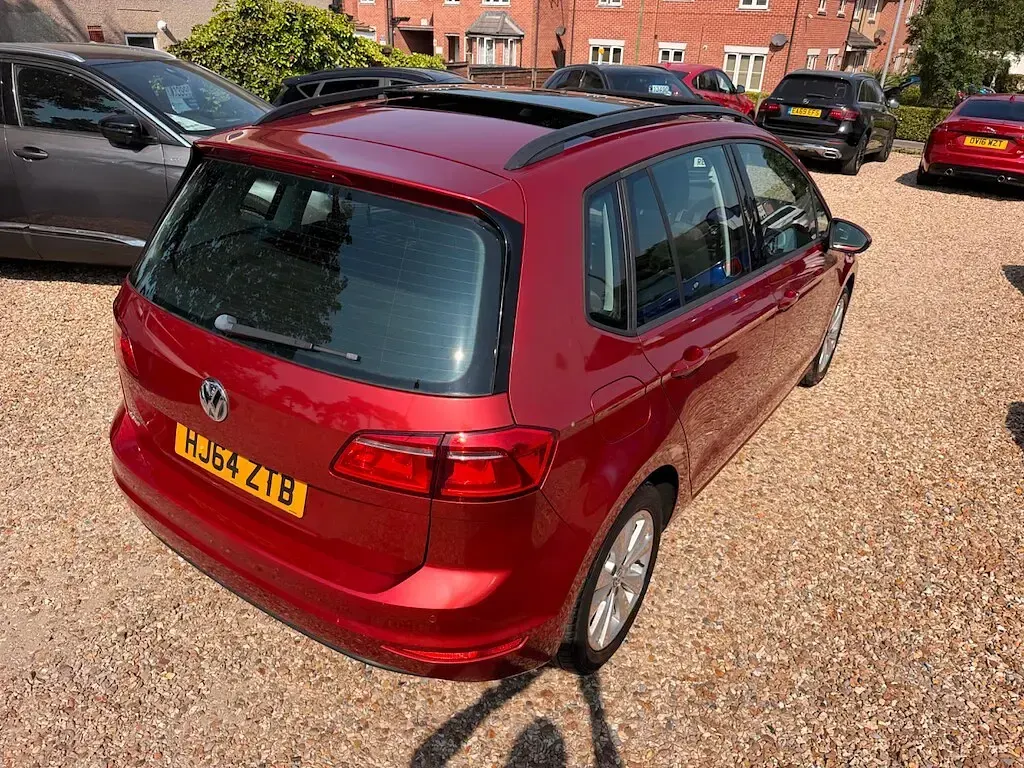 Used VW Golf Sportsvan SE 125 HP (91 kW) 2014 Red with dark interior trim MPV