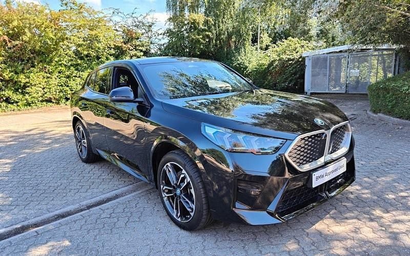 Black sapphire metallic paint Used 2024 BMW iX2 M Sport SUV | £38,632 (Fair price) - Image 1/4