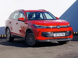 Metallic persimmon red New 2024 VW Tiguan Life SUV | £31,498