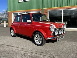 Flame red with white roof Used 1998 Mini Cooper Hatchback | £24,995