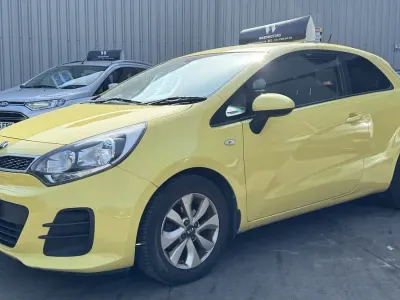 Used Kia Rio 84 HP (61 kW) 2015 Yellow Hatchback