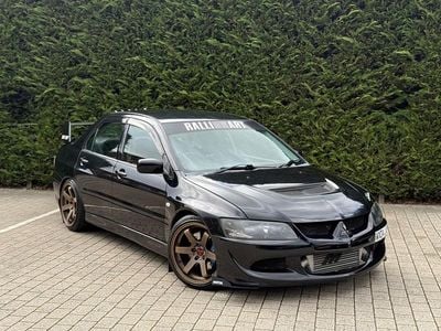 Used Mitsubishi Lancer 372 HP (273 kW) 2004 Black Sedan