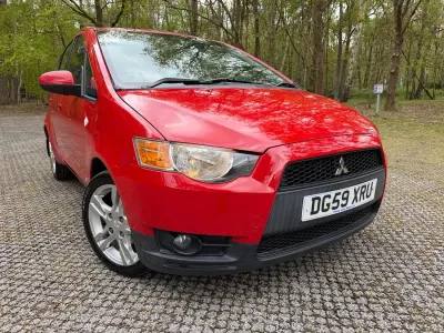 Usado Mitsubishi Colt 95 HP (69 kW) 2009 Vermelho Citadino