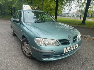 Używany Nissan Almera 90 KM (66 kW) 2002 Szary Hatchback