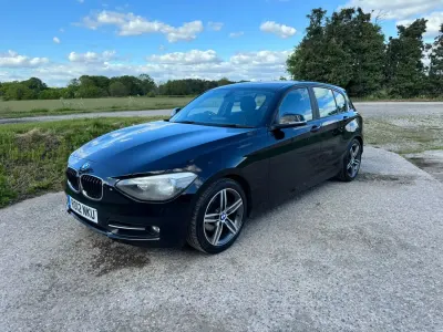 Usado BMW 120 Sport Line 184 CV (135 kW) 2012 Negro Utilitario