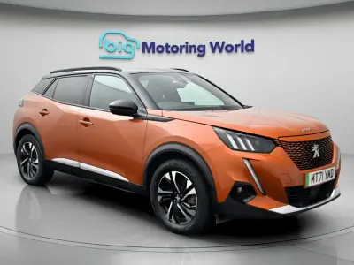 Second-hand Peugeot e-2008 GT 100 kW (136 CP) 2021 Portocaliu SUV