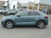 Used VW T-Roc R-line 150 HP (110 kW) 2023 Petrol blue black roof SUV