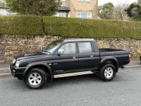 Käytetty Mitsubishi L200 113 HP (83 kW) 2006 Musta Nouto
