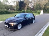 Begagnad BMW 114 2014 Svart Halvkombi