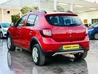 Używany Dacia Sandero Ambiance 90 KM (66 kW) 2014 Czerwony Hatchback