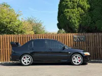 Used Mitsubishi Lancer 261 HP (191 kW) 2004 Black Sedan
